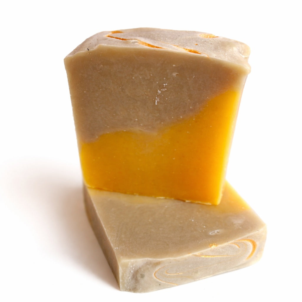 2 bars of handmade cucumber melon soap on a white background