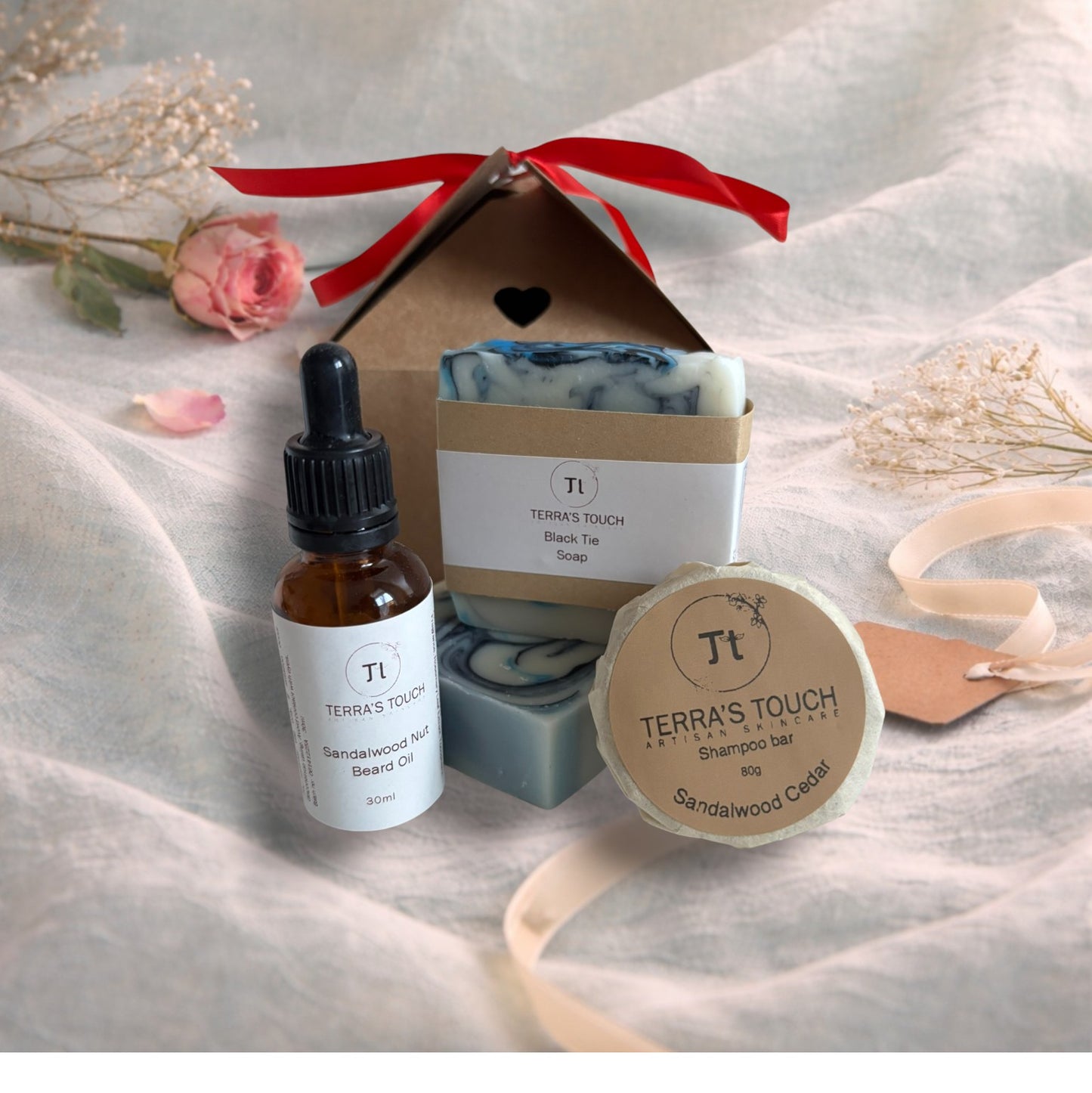 handmade soap, face or beard oil and shampoo bar on a valentine background with aqua linen, pink rose and craft gift box