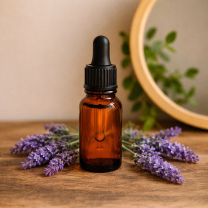 lavender face oil in brown bottle with dropper and lavender flowers in a country chic decor with mirror