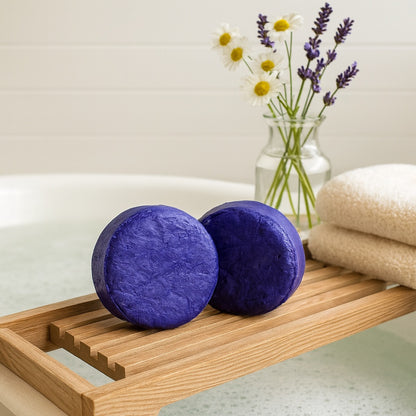 purple toning shampoo bar on a wooden bench with chamomile and lavender flowers in a vase